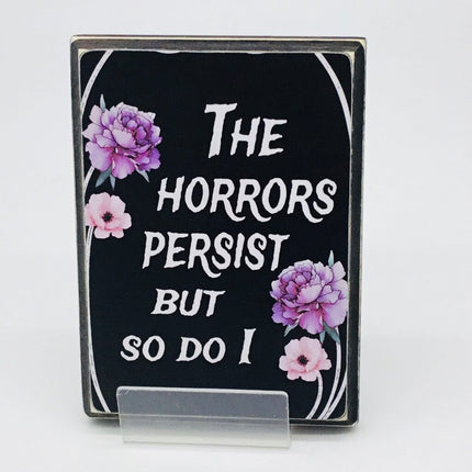 The horrors persist wall plaque