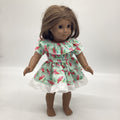 Light green dress with mushrooms all over. Ruffles around neckline and bottom skirt.