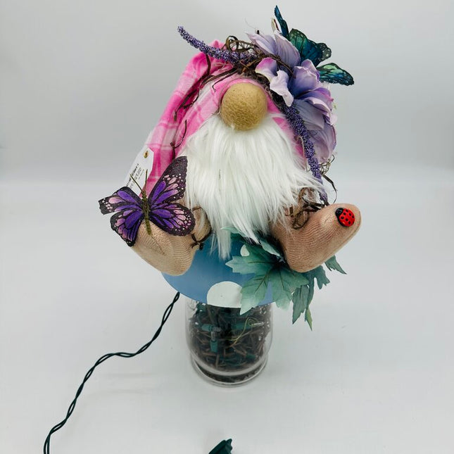 Mushroom blue gnome sitting on top