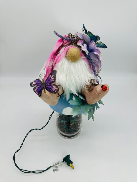 Mushroom blue gnome sitting on top