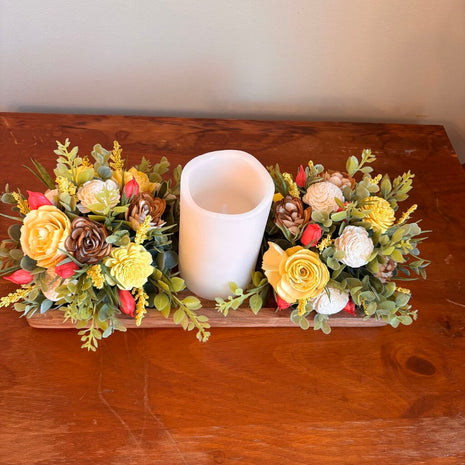Candle surrounded by Yellow and White Sola Wood Flowers