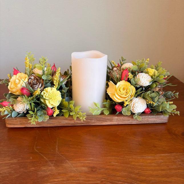 Candle surrounded by Yellow and White Sola Wood Flowers