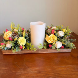 Candle surrounded by Yellow and White Sola Wood Flowers - view 2