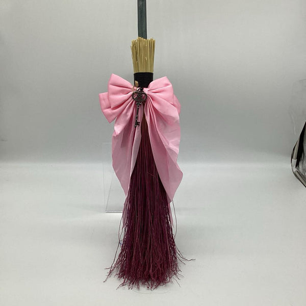 Pink bow broom