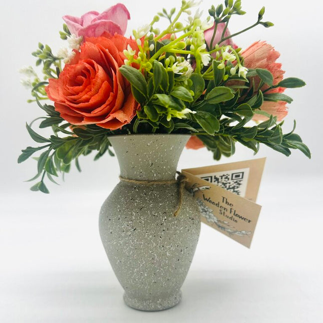 Gray Vase filled with Sola Wood Flowers