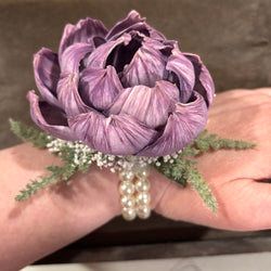 Wrist Corsage with a Purple Sola Wood Flower on a pearl bracelet - view 3