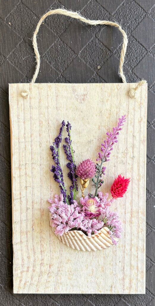 Wood with broken half shell, pink/purple flowers