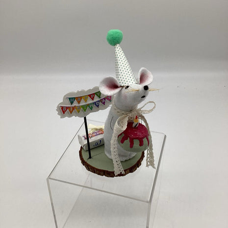 Birthday Mouse holding green cake with candle