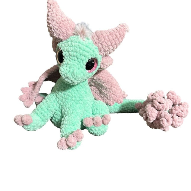 Crocheted feather tail dragon sitting
