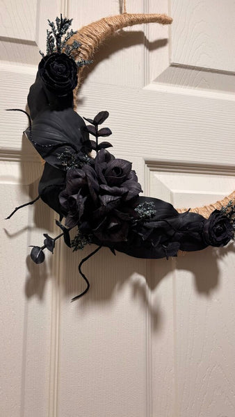 Black Moon made with Black Sola Wood Flowers and pops of blue