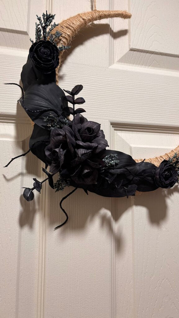 Black Moon made with Black Sola Wood Flowers and pops of blue