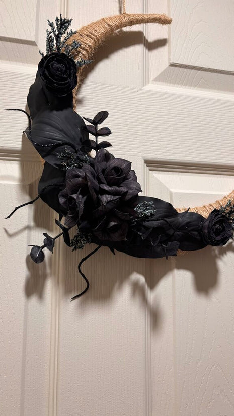 Black Moon made with Black Sola Wood Flowers and pops of blue