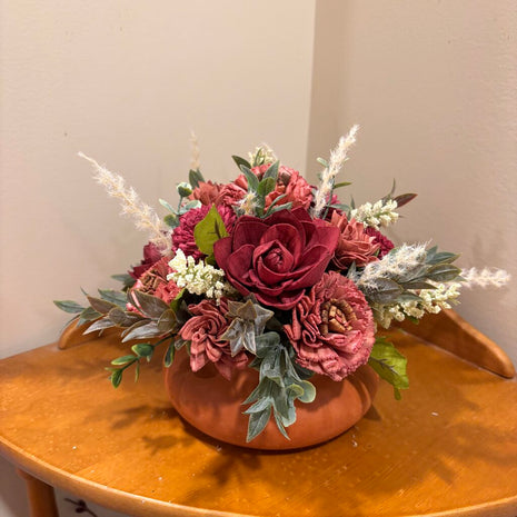 Low Terracotta Pot filled with Rust and Maroon colored Sola Wood Flowers