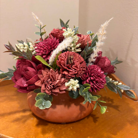 Low Terracotta Pot filled with Rust and Maroon colored Sola Wood Flowers
