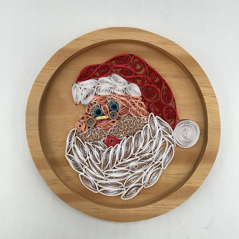 Santa's jolly face on wooden plaque