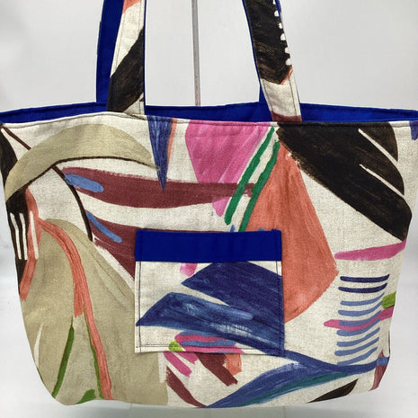 Multi colored leaf w/ blue reversible tote bag