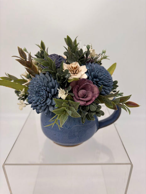 Blue Cup filled with Blue, Purple and White Sola Wood Flowers