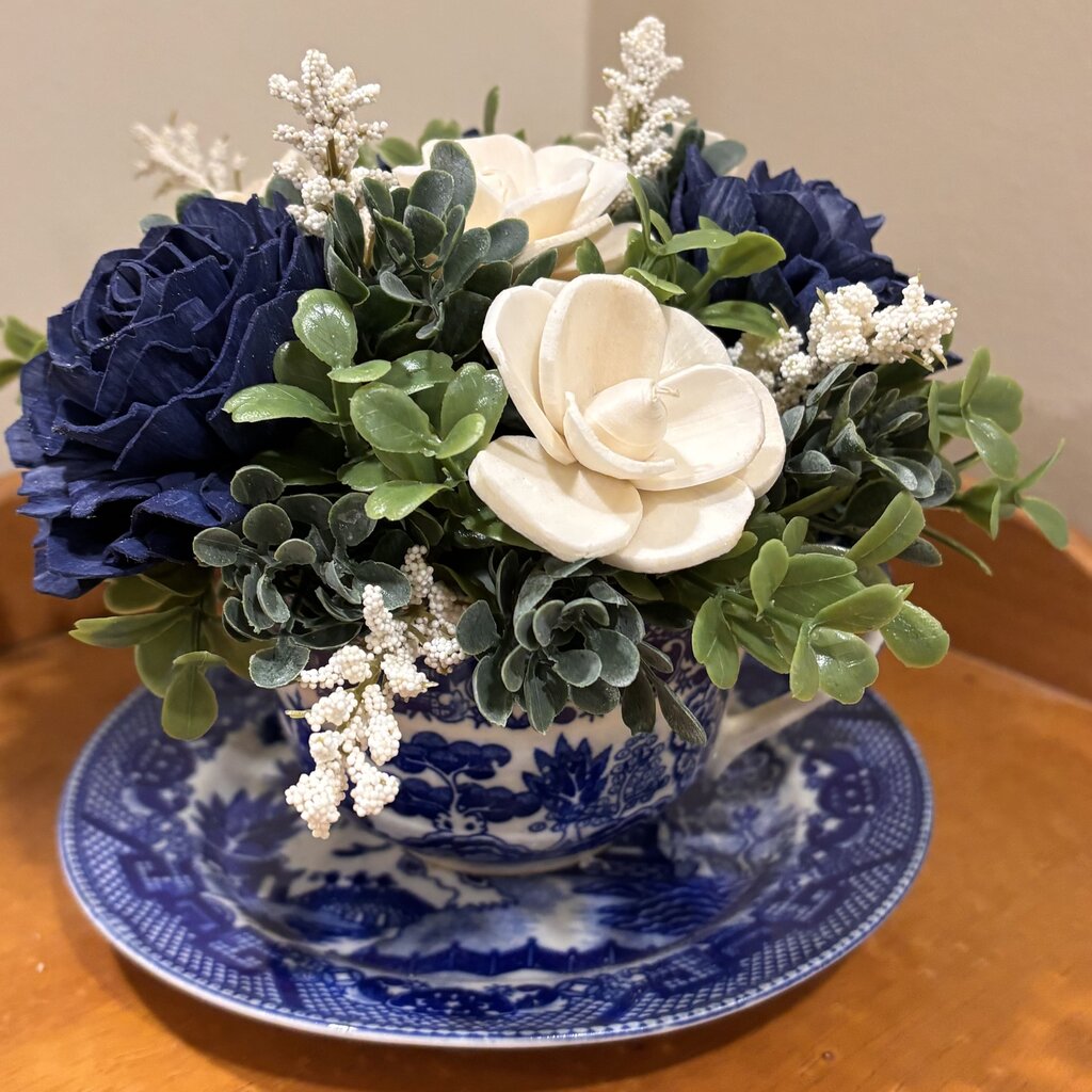 Tea Cup filled with Blue and White Sola Wood Flowers
