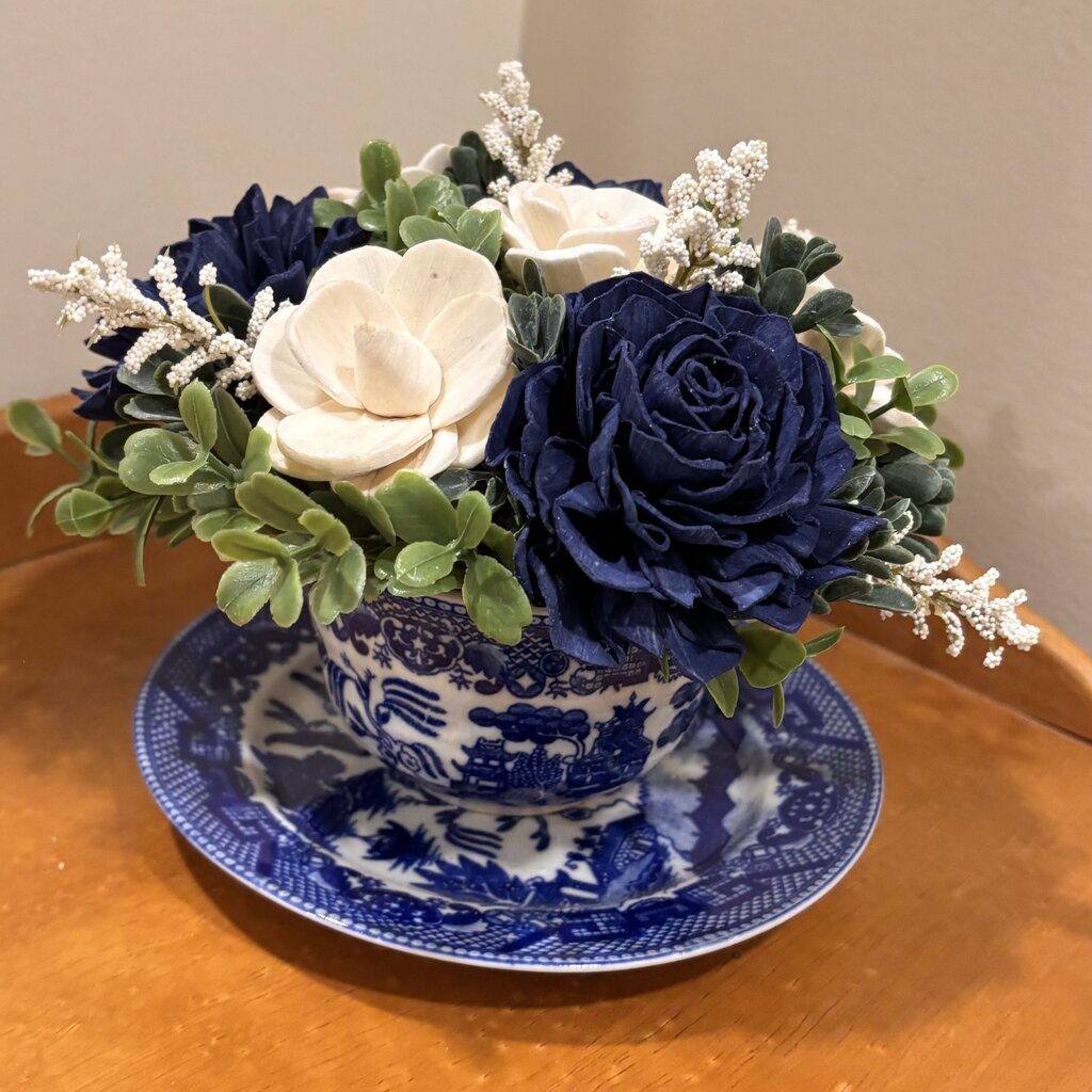 Tea Cup filled with Blue and White Sola Wood Flowers
