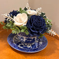 Tea Cup filled with Blue and White Sola Wood Flowers