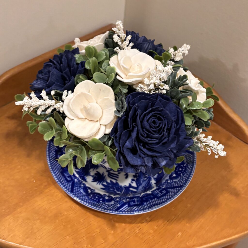 Tea Cup filled with Blue and White Sola Wood Flowers