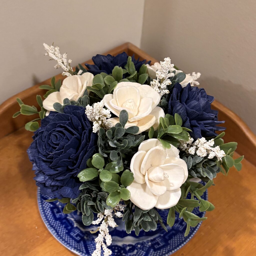 Tea Cup filled with Blue and White Sola Wood Flowers